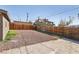 Wide gravel backyard features a concrete patio area and fencing, ideal for entertainment at 1844 Yale St, North Las Vegas, NV 89030