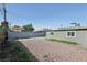 Spacious gravel backyard featuring a gray block wall and room for outdoor activities at 1844 Yale St, North Las Vegas, NV 89030