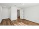 Open bedroom showcases new flooring and a door leading to other rooms at 1844 Yale St, North Las Vegas, NV 89030