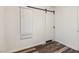 Clean bedroom with laminate flooring, window, and a barn door for a modern feel at 1844 Yale St, North Las Vegas, NV 89030