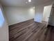 Bright bedroom with wood-look flooring and large windows offering plenty of natural light at 1844 Yale St, North Las Vegas, NV 89030