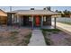 Charming front exterior featuring stone accents, a cozy porch, and a well-maintained walkway at 1844 Yale St, North Las Vegas, NV 89030