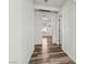 Hallway with sleek flooring and a view into a bright, window-lit room for a warm and inviting feel at 1844 Yale St, North Las Vegas, NV 89030