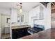 Charming kitchen features stainless steel appliances, black cabinets, and wood accents at 1844 Yale St, North Las Vegas, NV 89030