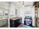 Classic kitchen features modern gas range, stainless steel sink, and updated light fixture at 1844 Yale St, North Las Vegas, NV 89030
