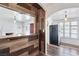 Eat-in kitchen with wood breakfast bar and stainless refrigerator at 1844 Yale St, North Las Vegas, NV 89030