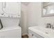 Stackable washer and dryer is conveniently located near the utility sink and cabinet at 1844 Yale St, North Las Vegas, NV 89030