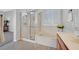 Bathroom featuring a glass shower and soaking tub at 2110 Fort Sanders St, Henderson, NV 89052