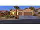 Charming single-story home features a two-car garage and desert landscaping at 2110 Fort Sanders St, Henderson, NV 89052