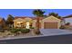 Charming single-story home features a two-car garage and desert landscaping at 2110 Fort Sanders St, Henderson, NV 89052