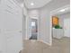 Hallway shows transition to bedroom and laundry room featuring tile flooring for easy maintenance at 2110 Fort Sanders St, Henderson, NV 89052
