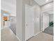 Tiled hallway with neutral walls and carpet flooring in rooms at 2110 Fort Sanders St, Henderson, NV 89052