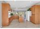 Spacious kitchen featuring wood cabinets, granite countertops, and a central island at 2110 Fort Sanders St, Henderson, NV 89052