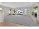 Bright living room features neutral carpet, fireplace, and large windows with mountain views at 2110 Fort Sanders St, Henderson, NV 89052