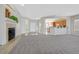 Spacious living room boasts neutral carpet, fireplace, and open layout at 2110 Fort Sanders St, Henderson, NV 89052