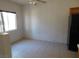 Bright view of the dining space showing the kitchen bar, black fridge, and tile flooring at 2110 Los Feliz St # 1083, Las Vegas, NV 89156