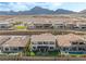Stunning aerial view of a two-story home nestled in a vibrant neighborhood with many pools at 212 Harris Peak St, Las Vegas, NV 89138