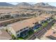 Expansive aerial view of a beautiful home with mountain views and a lovely pool at 212 Harris Peak St, Las Vegas, NV 89138