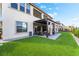 Well-designed backyard with artificial turf, covered patio, and elegant landscaping at 212 Harris Peak St, Las Vegas, NV 89138