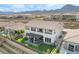 Gorgeous outdoor living space with a pergola-covered patio, artificial grass, and mountain views at 212 Harris Peak St, Las Vegas, NV 89138