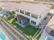 Expansive backyard featuring a pergola-covered patio and an artificial grass lawn at 212 Harris Peak St, Las Vegas, NV 89138
