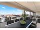 Balcony view with an outdoor dining table and seating area, with views of the neighborhood at 212 Harris Peak St, Las Vegas, NV 89138