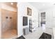 Well-lit bathroom features tile shower and a convenient linen storage area at 212 Harris Peak St, Las Vegas, NV 89138