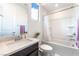 Bright bathroom features a shower-tub combo, and granite countertops at 212 Harris Peak St, Las Vegas, NV 89138