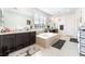 Bright bathroom has a soaking tub, double vanity, and modern fixtures at 212 Harris Peak St, Las Vegas, NV 89138