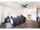 Stylish bedroom features wood floors, ceiling fan, and adjacent bathroom for added convenience at 212 Harris Peak St, Las Vegas, NV 89138