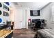 View of a bedroom with a desk and wood look floors at 212 Harris Peak St, Las Vegas, NV 89138