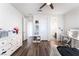 Bedroom with light wood floors and white walls, featuring a vanity desk and plentiful storage at 212 Harris Peak St, Las Vegas, NV 89138