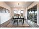 Dining room with stylish chandelier, large windows, and modern decor at 212 Harris Peak St, Las Vegas, NV 89138