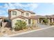 Charming two-story home with a beautifully landscaped front yard and a modern garage at 212 Harris Peak St, Las Vegas, NV 89138