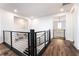 Bright hallway features wood floors, modern railings and stylish lighting at 212 Harris Peak St, Las Vegas, NV 89138