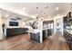 Open-concept kitchen and living room with expansive island and seating at 212 Harris Peak St, Las Vegas, NV 89138