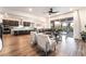 Open concept living area with barstool seating at island and view into the backyard at 212 Harris Peak St, Las Vegas, NV 89138