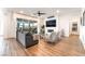 Spacious living room with a fireplace, modern furniture, and light wood-look floors at 212 Harris Peak St, Las Vegas, NV 89138