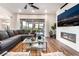 Spacious living room featuring modern fireplace and sliding glass doors at 212 Harris Peak St, Las Vegas, NV 89138