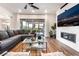 Spacious living room featuring modern fireplace and sliding glass doors at 212 Harris Peak St, Las Vegas, NV 89138