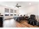 Spacious main bedroom with wood flooring, natural light and a seating area at 212 Harris Peak St, Las Vegas, NV 89138