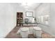 Staged office area with white walls, brown flooring, and shutters on the window at 212 Harris Peak St, Las Vegas, NV 89138