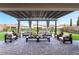 Inviting outdoor patio with comfortable seating, pergola, and stylish decor at 212 Harris Peak St, Las Vegas, NV 89138