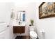 Contemporary powder room features floating vanity, accent wall, and modern fixtures at 212 Harris Peak St, Las Vegas, NV 89138
