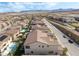 Spacious backyard and neighborhood view featuring a well-manicured lawn and tiled roof at 212 Harris Peak St, Las Vegas, NV 89138