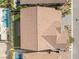 Aerial view showing the tile roof, backyard with artificial turf and a pergola at 212 Harris Peak St, Las Vegas, NV 89138
