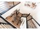 Open staircase featuring wood stairs, modern railings and stylish decor at 212 Harris Peak St, Las Vegas, NV 89138