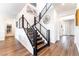 Staircase with dark wood steps, steel railing, and modern lighting at 212 Harris Peak St, Las Vegas, NV 89138