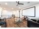 Second-floor theater room with large screen, comfortable seating, and modern lighting at 212 Harris Peak St, Las Vegas, NV 89138