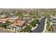 A tranquil aerial view of a well-maintained neighborhood featuring mature landscaping and neighborhood pool at 2154 Tortona St, Henderson, NV 89044